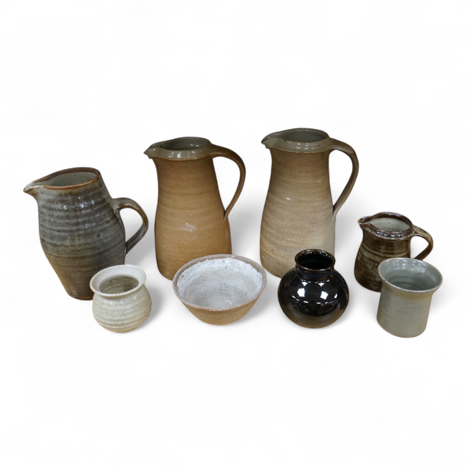 A group of Leach St. Ives pottery jugs and a pot and three other studio items of studio ceramics, some with impressed marks, largest 25cm high